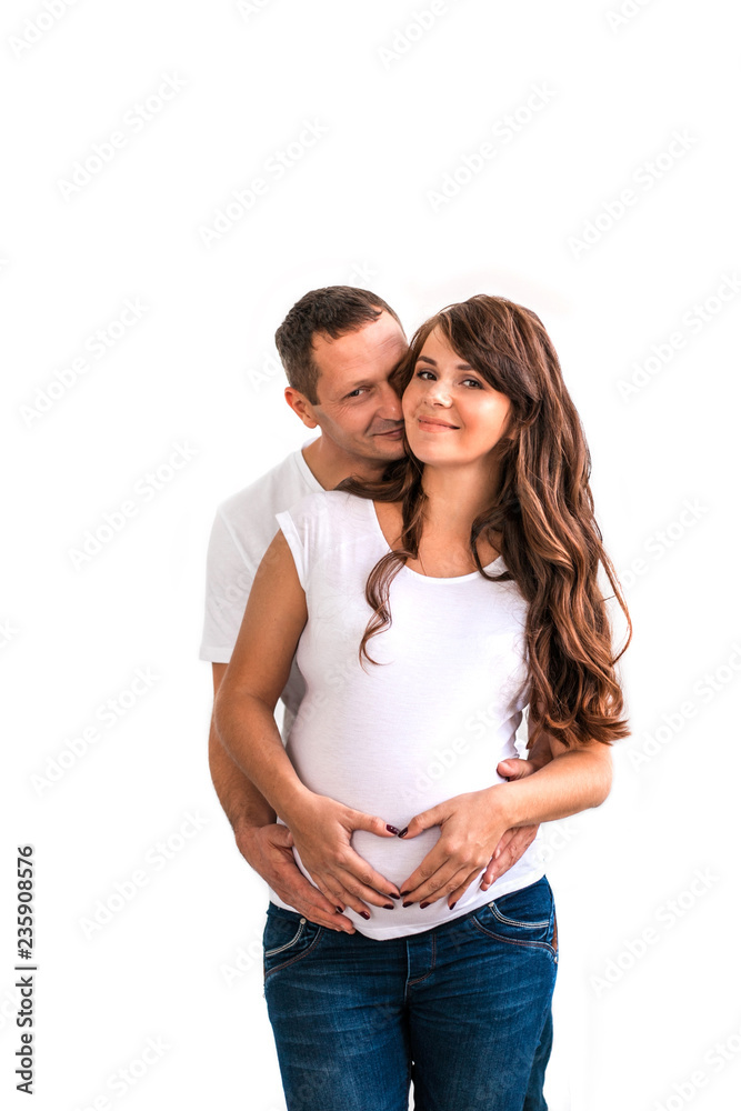 Pregnant couple hug and hold pregnant belly. Pregnant couple hug and hold pregnant belly.