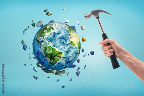 Fototapeta Naklejka Na Ścianę i Meble -  The earth is shattered after being hit by a hammer.