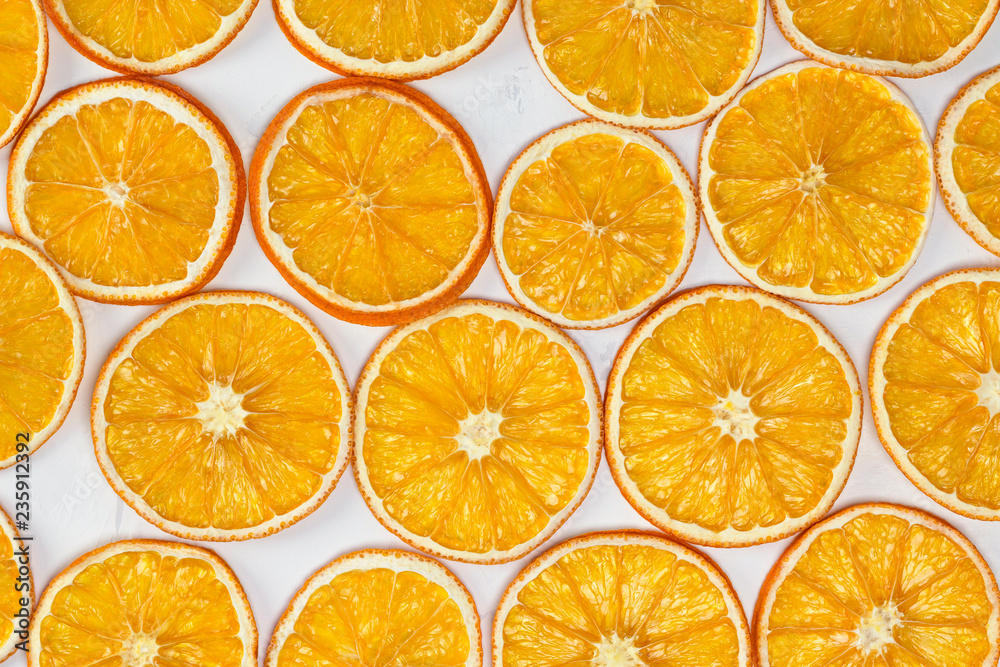 Dried oranges background. Christmas, New Year, recipe, culinary concept. Top view, flat lay, close-up Dried oranges background. Christmas, New Year, recipe, culinary concept. Top view, flat lay, close-up