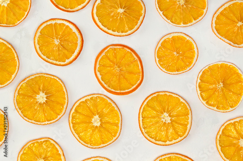 Dried oranges background. Christmas, New Year, recipe, culinary concept. Top view, flat lay, close-up