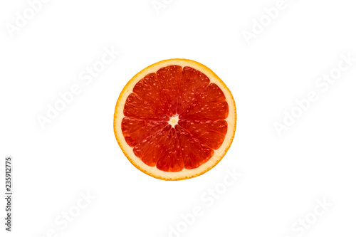 Top view of a red grapefruit slice on a white background. Healthy diet  tropical fruit.