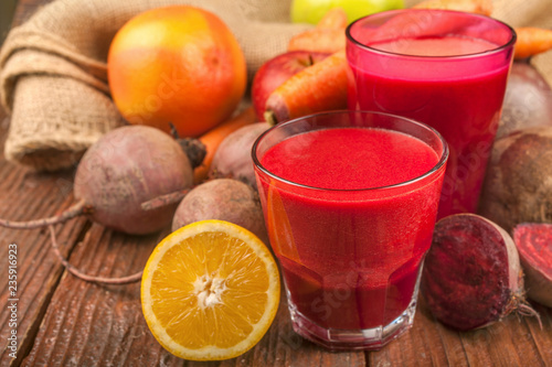 Smoothie from beetroot, lemon, grapefruit, carrots and apples. Fresh, healthy and homemade.