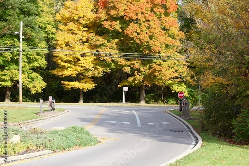 The empty intersection of the country road on a fall day.