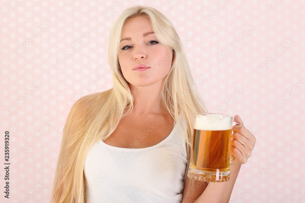 Young beautiful girl with mug of light beer Young beautiful girl with mug of light beer