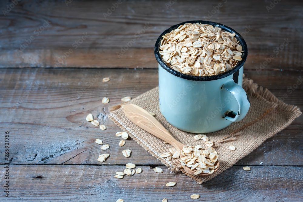 oat flakes on wooden table. healthy food concept. oat flakes on wooden table. healthy food concept.
