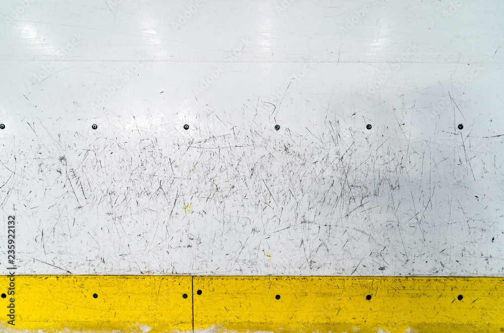 Fototapeta premium Hockey rink boards with scratched and damaged surface