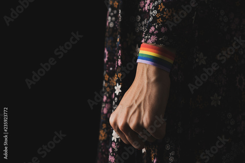 woman with a rainbow-patterned ribbon in his wrist