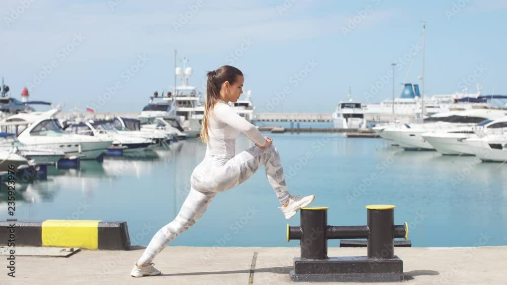 Fitness women doing crossfit training outdoors showing power and strength.