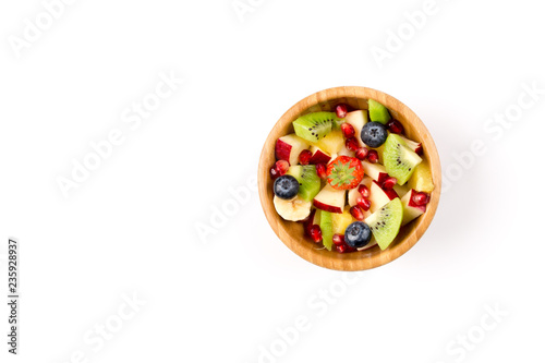 Fruit Salad in Wooden Bowl on White Table, Top View, copy space