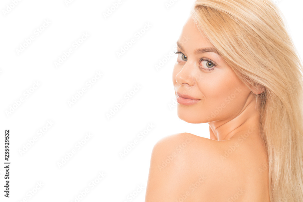 Studio close up of a beautiful young woman with perfect skin and long healthy strong hair smiling to the camera over her shoulder isolated on white copyspace body skin face cosmetology spa beauty Studio close up of a beautiful young woman with perfect skin and long healthy strong hair smiling to the camera over her shoulder isolated on white copyspace body skin face cosmetology spa beauty