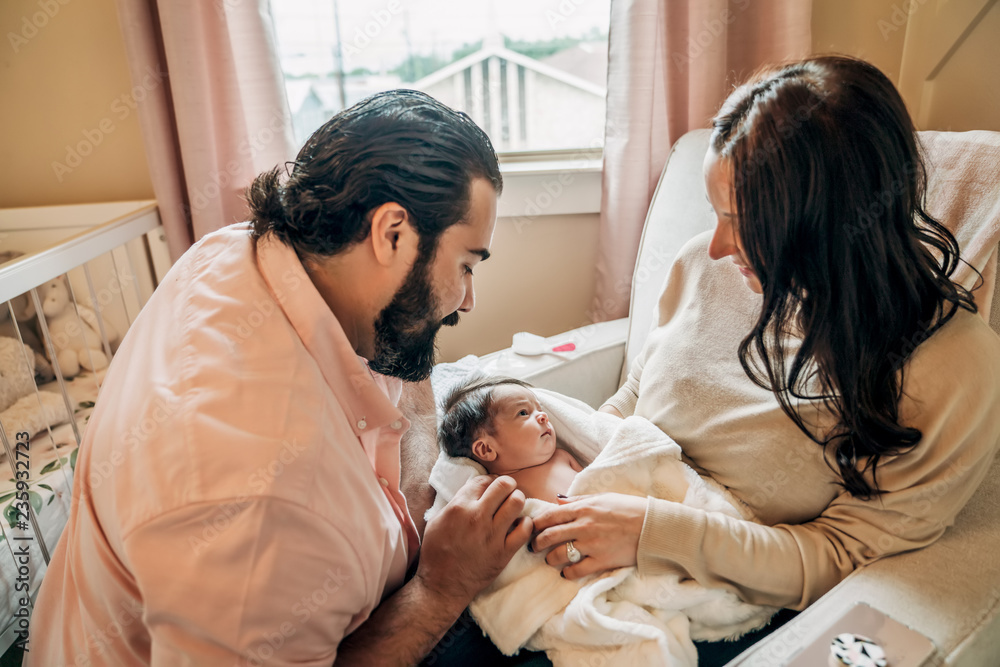 Parents bonding with newborn baby Parents bonding with newborn baby