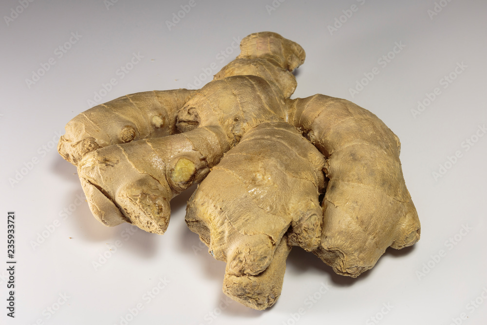 Ginger root on a white background, Asian food and popular Asian spice. Ginger root on a white background, Asian food and popular Asian spice.