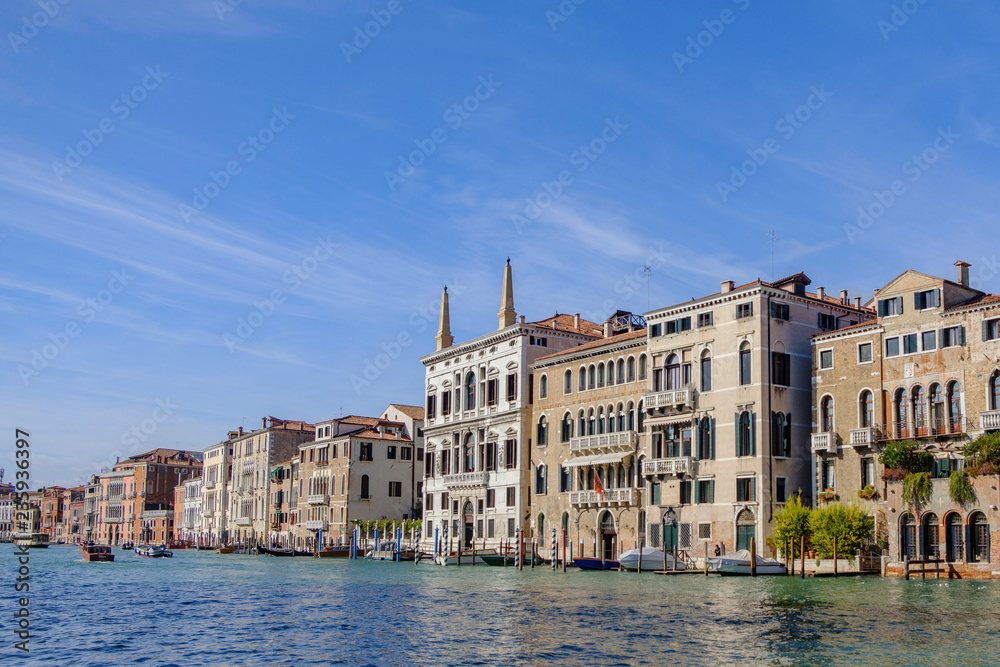 Scenic view of wide channel (Grand channel) and colorful houses in ancient touristic town Venice in Italy Scenic view of wide channel (Grand channel) and colorful houses in ancient touristic town Venice in Italy