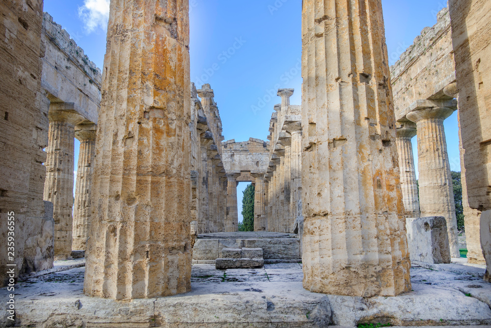 Scenic view of ruins of ancient greek temple in ancient touristic town Paestum in Italy Scenic view of ruins of ancient greek temple in ancient touristic town Paestum in Italy