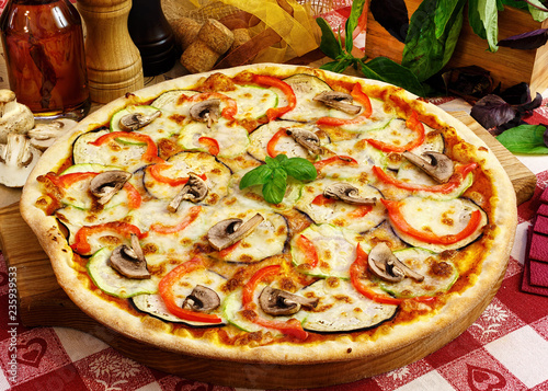 Italian pizza on wooden background