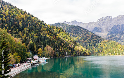 Beautiful lake surrounded by mountains and forests in autumn, Ritsa, Abkhazia.