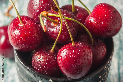  Juicy cherries with water drops, close up