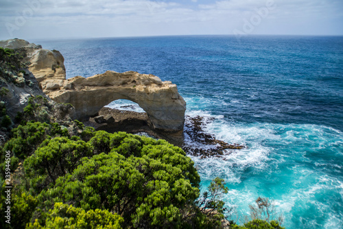 Travel Victoria, Australia. Beautiful view of the London Arch, tourist popular attraction/stop on Great Ocean Road near Melbourne and Twelve Apostles. Bright colours, clear summer day.