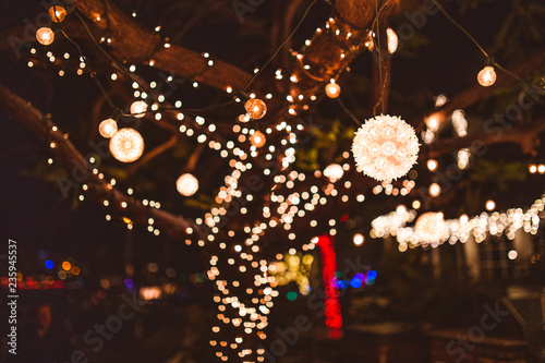 Bright lights wrapped around a tree