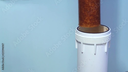 highly used water filter hand in glove