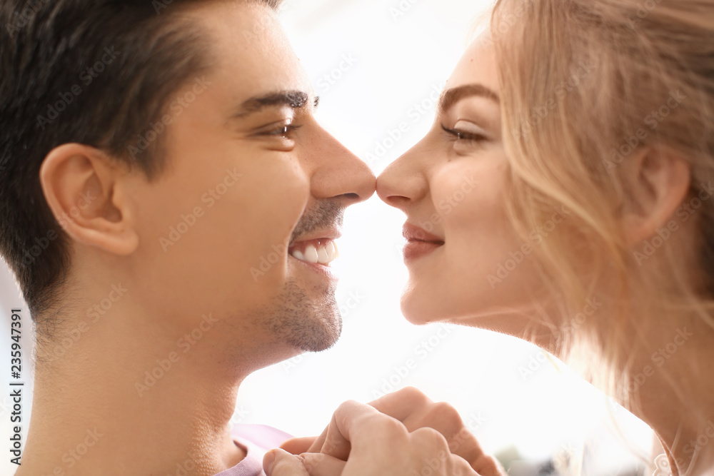 Cute young couple dancing on light background Cute young couple dancing on light background