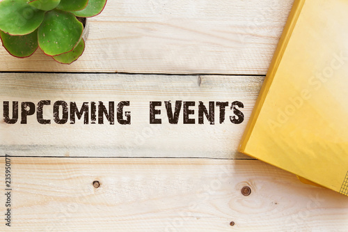 upcoming on wooden table concept
