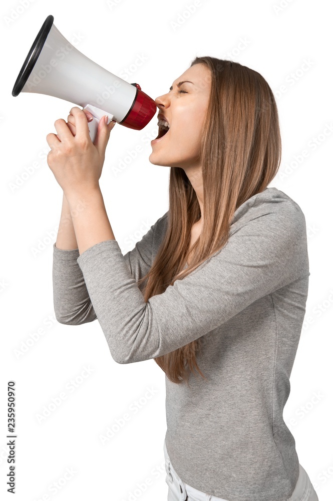 young adult shouting on a megaphone young adult shouting on a megaphone