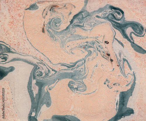 Stains of paint on paper. The texture of the splashes and spots of paint. EBRU- Ancient oriental drawing technique. Chaotic abstract organic design. Marbleized.