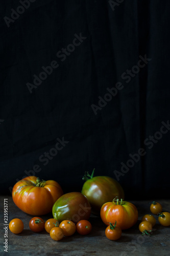 Tomatoes against a black background