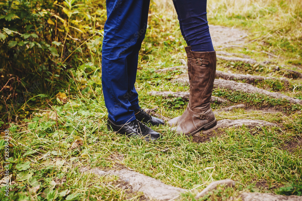 Man and woman on a walk in the autumn forest. Close up Man and woman on a walk in the autumn forest. Close up