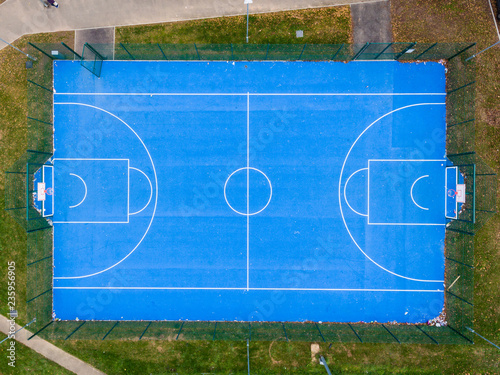 Aerial view of basketball court without players in public park in St Mellons Cardiff UK. Top view of basketball court photo