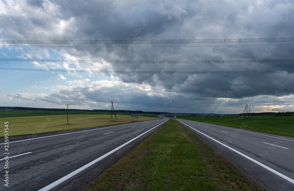 Highway before the storm. Dramatic clouds Highway before the storm. Dramatic clouds