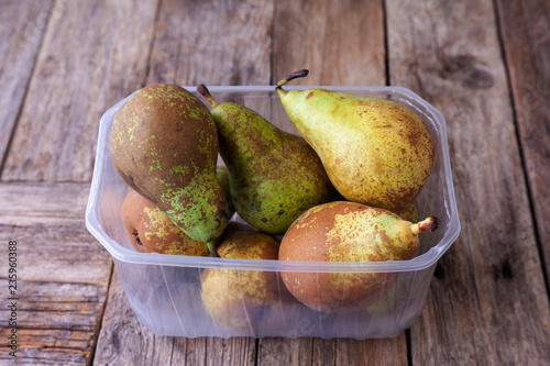 Wallpaper Mural Pears in a plastic box on rustic background Torontodigital.ca