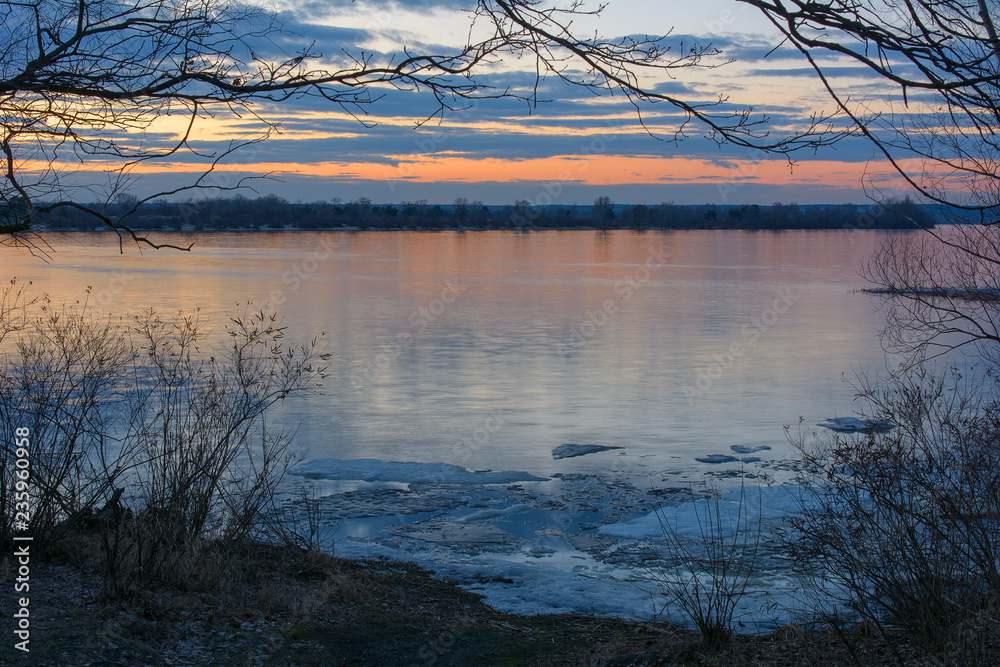 Sunset over the Dnipro river in Kyiv, Ukraine in the early spring Sunset over the Dnipro river in Kyiv, Ukraine in the early spring