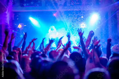 crowd of people dancing in disco club
