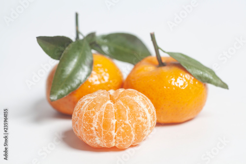 Ripe mandarins with green leaves