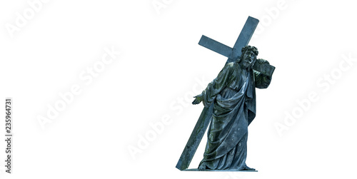 The road to Golgotha. Ancient statue of Jesus Christ with cross. Faith, religion, God, suffering concept.