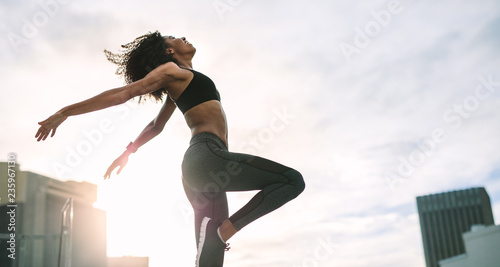 Fitness woman doing work out on rooftop
