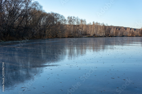 a frozen river shore