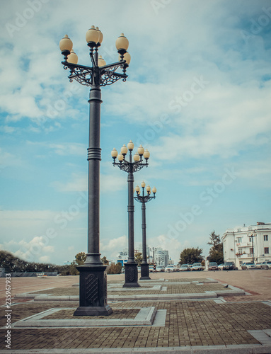sunrise view on st marco square between illuminated street lamps