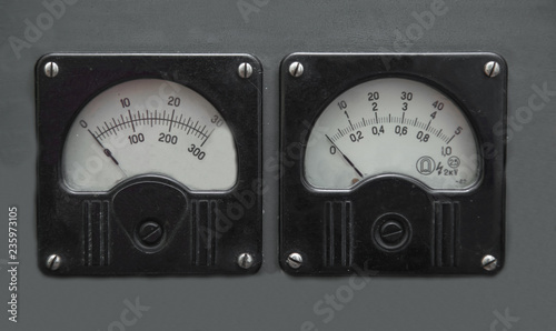 Retro devices on a wooden wall. Vintage measuring tools in a barn. Old phones.