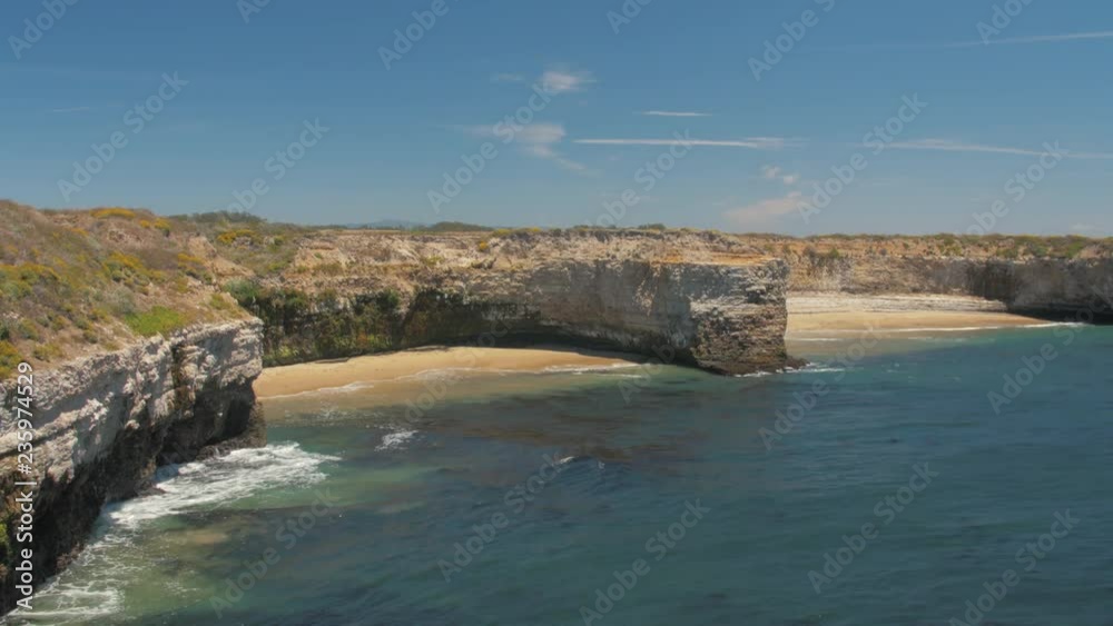 89 Calm waves hitting unreachable beaches and rocks 89 Calm waves hitting unreachable beaches and rocks
