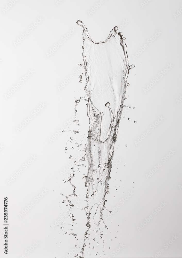 water splash with a lot of drops on a gray background water splash with a lot of drops on a gray background