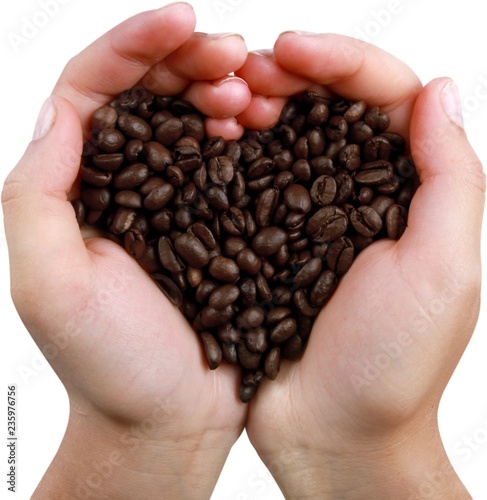 Hands Holding Coffee Beans Forming Heart