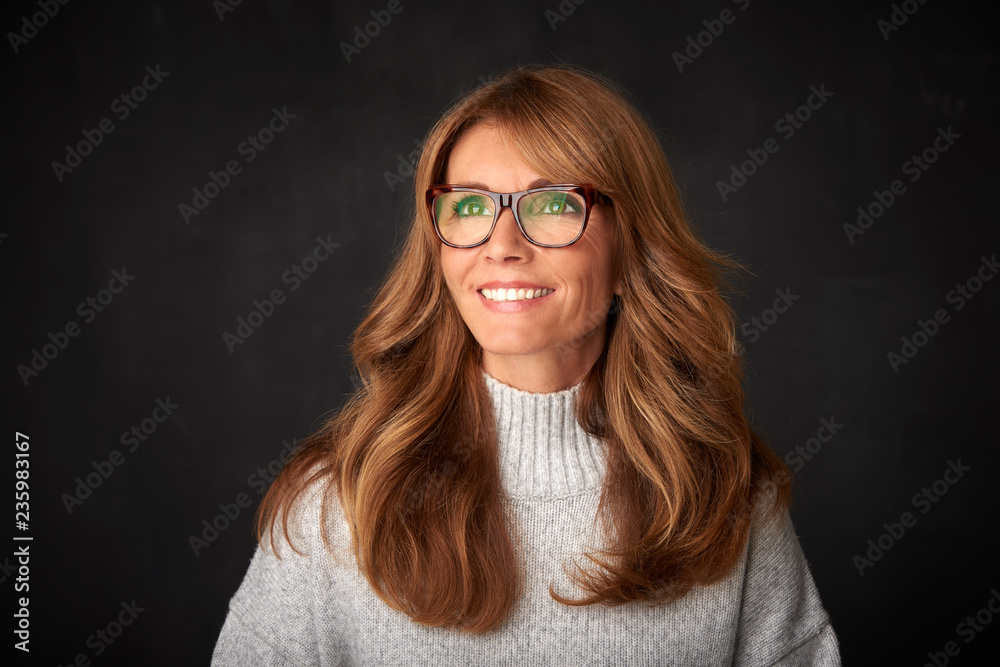 Close-up studio portrait of attractive middle aged woman Close-up studio portrait of attractive middle aged woman