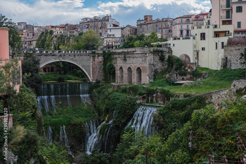 View of Tivoli from Gregorian villa with waterfalls and arch bridge photo