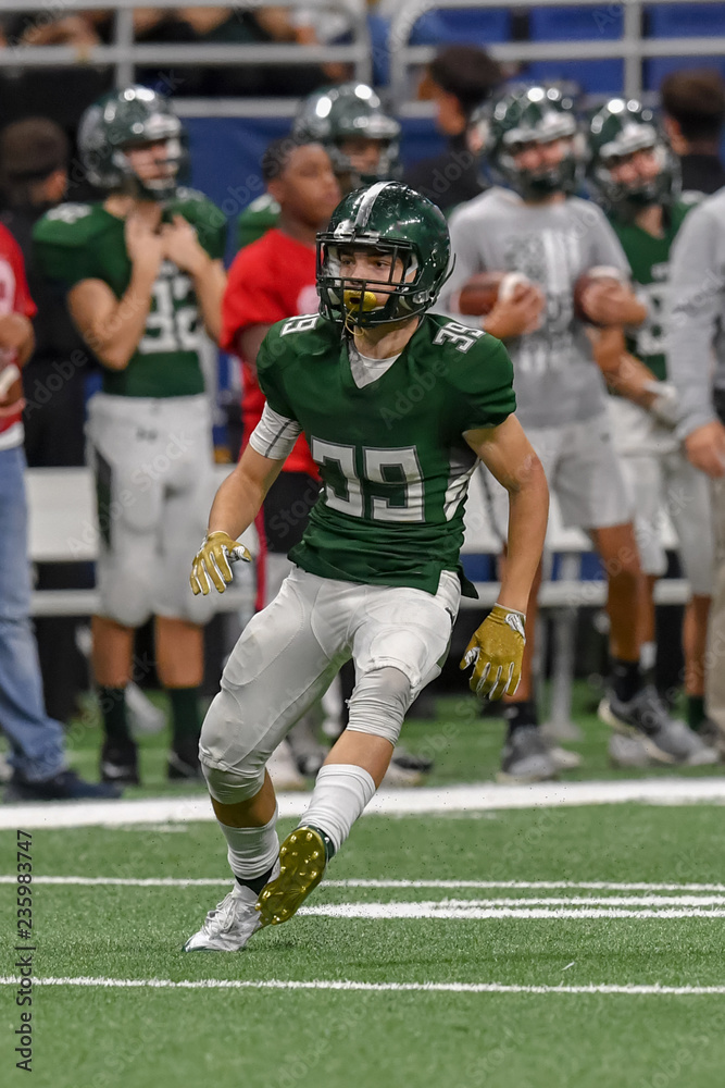 Great action shots of high school football player making amazing plays during a football game Great action shots of high school football player making amazing plays during a football game