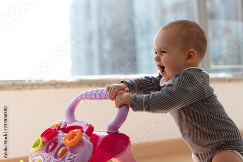 Happy baby girl excited to walk