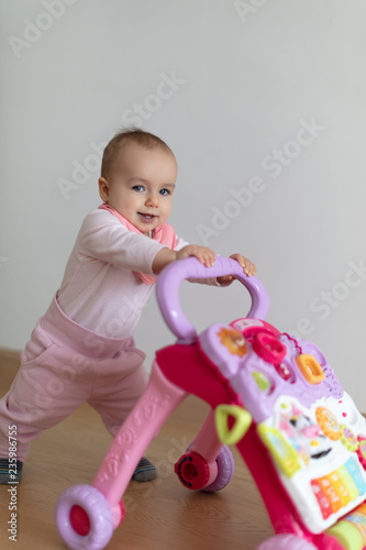 Happy baby girl excited to walk