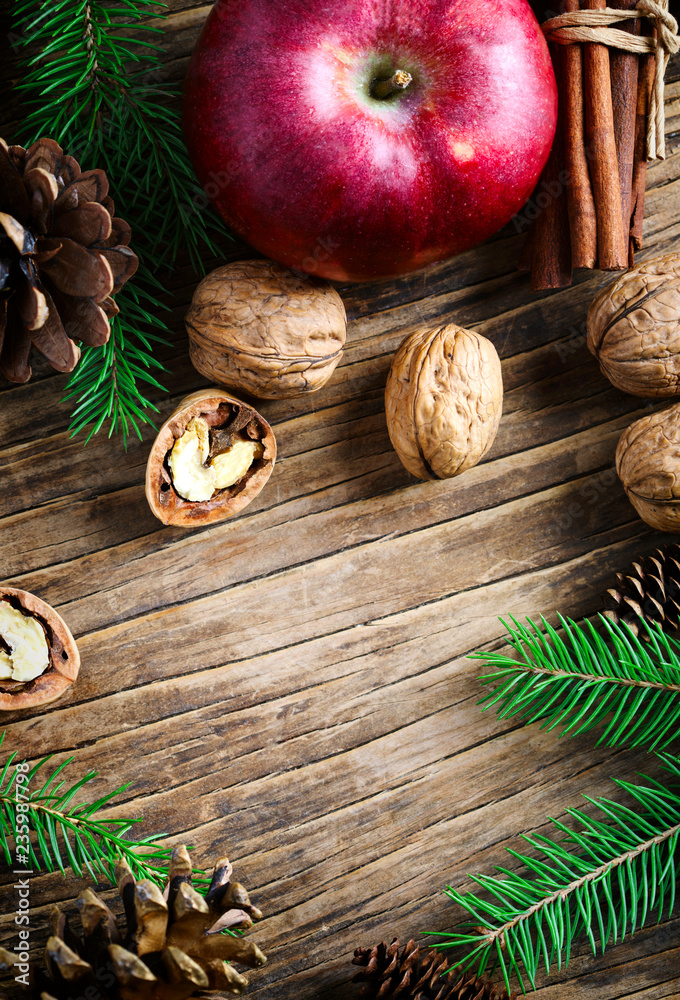 Christmas holiday background with fir branches, pine cones and nuts. Christmas holiday background with fir branches, pine cones and nuts.